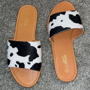 Mata cow print slide sandals